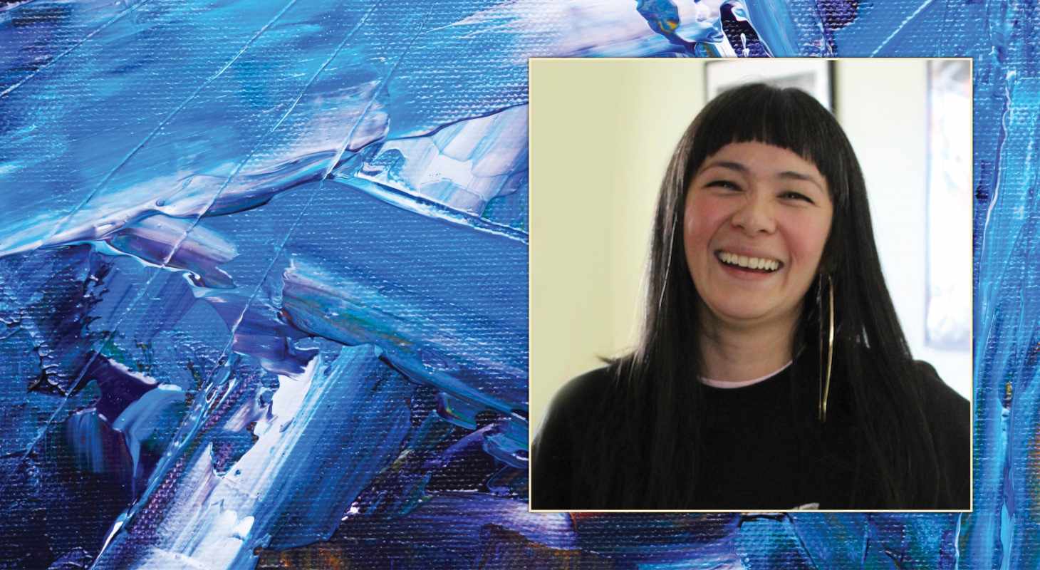 Photo of Thea Lim smiling against an abstract painted background