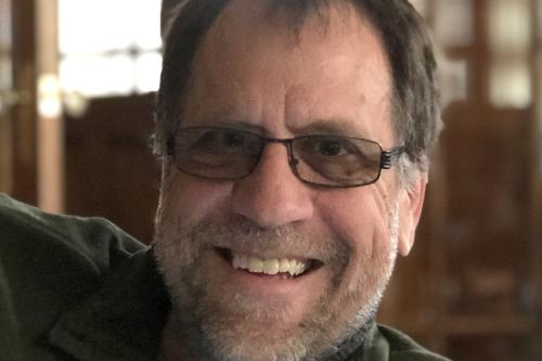 Smiling Photo of Professor John Vervaeke
