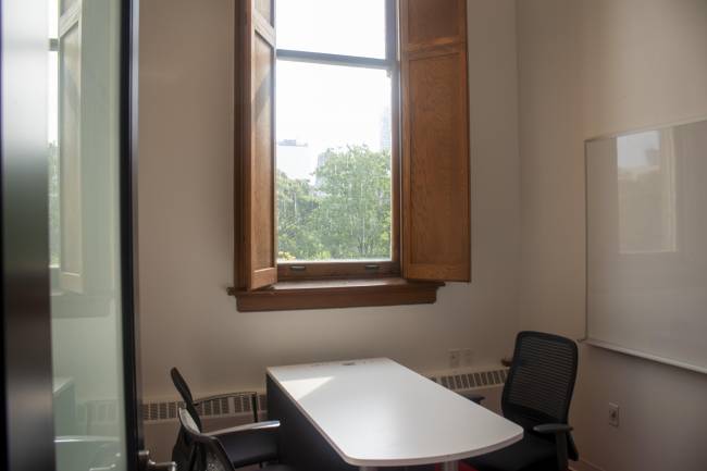 Small meeting room with two chairs and large window