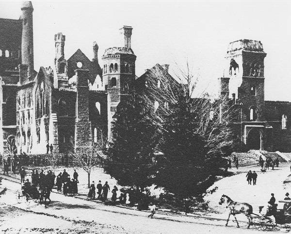 Damaged University College with pedestrians, carriages, and trees in foreground