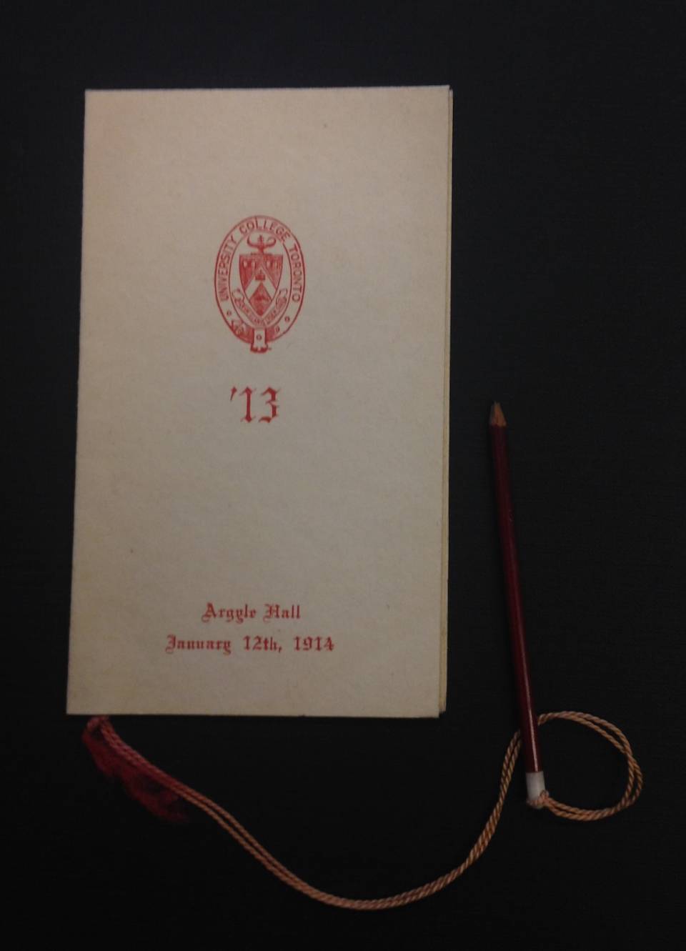 Front cover of a dance card with University College logo and the words "Argyle Hall, January 12th, 1914"
