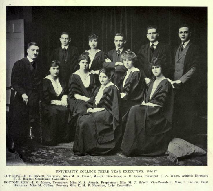 Six women and five men wearing academic robes
