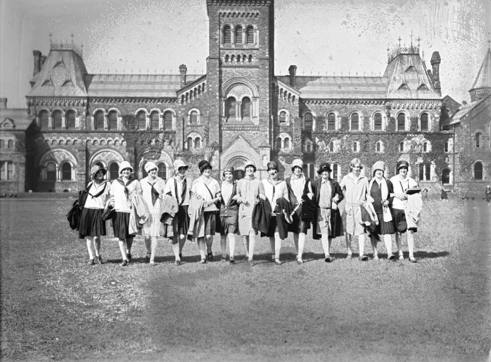 About 15 young women on front campus, with University College behind them
