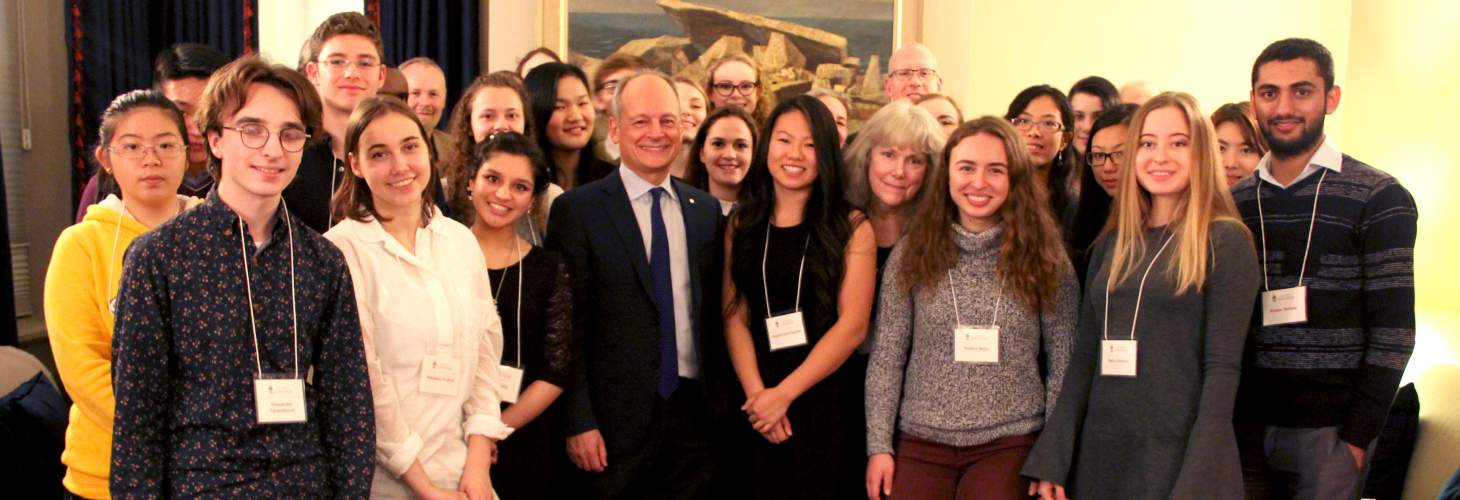 Students stand with Meric Gertler, and professors