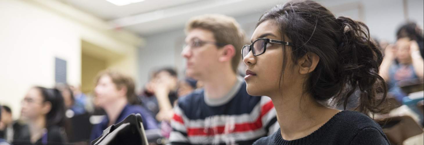 Students in class listening to a lecture 