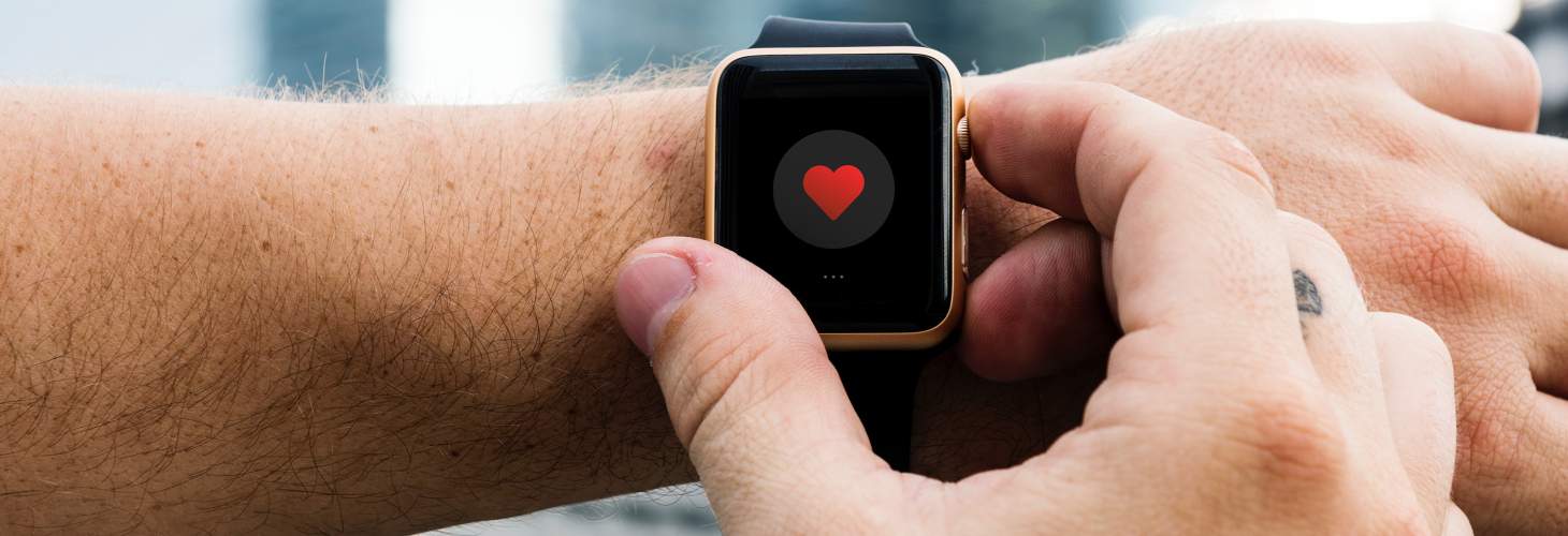Man checking heart rate on apple watch