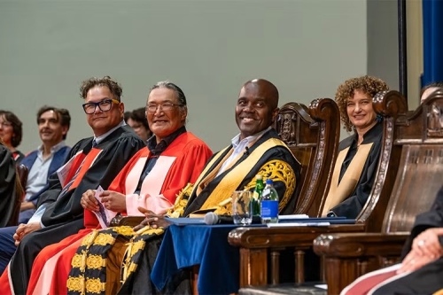 Jesse Wente, Zacharias Kunuk, Chancellor Wes Hall and Shannon Simpson sitting in academic regalia