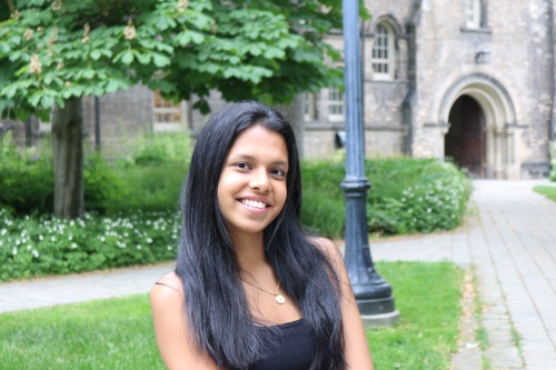 Headshot of Kiara Andrade on bench
