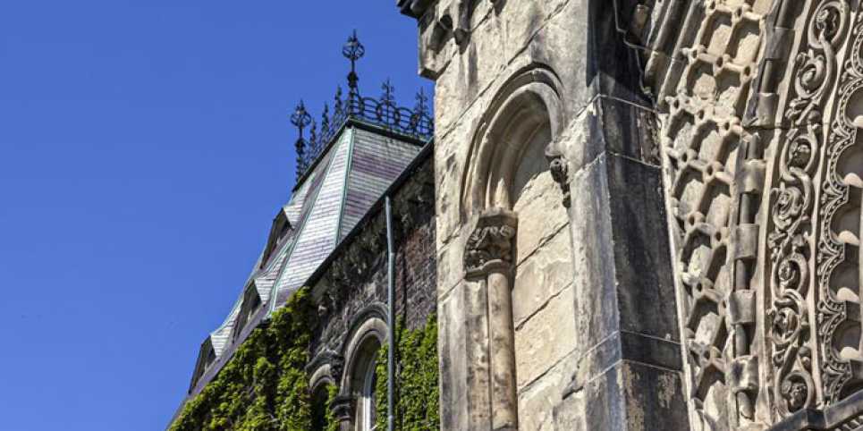 Side view of University College building in summer