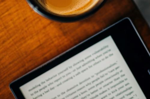 Photo of an eBook and a cup of coffee.