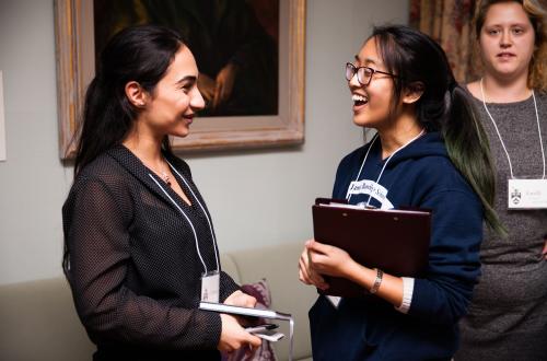 two students talking to each other