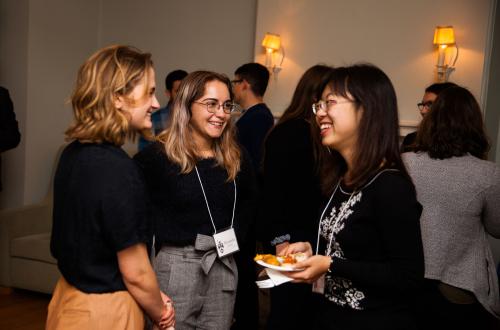 students and alumni mingling during a networking event