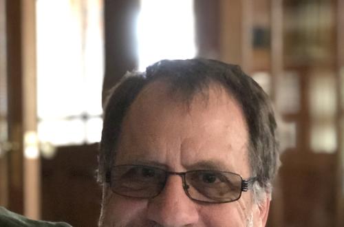 Smiling Photo of Professor John Vervaeke