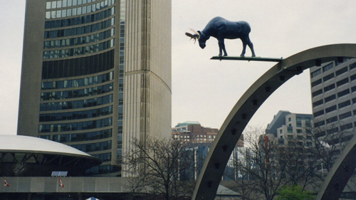 Statue of a moose suspended above city hall
