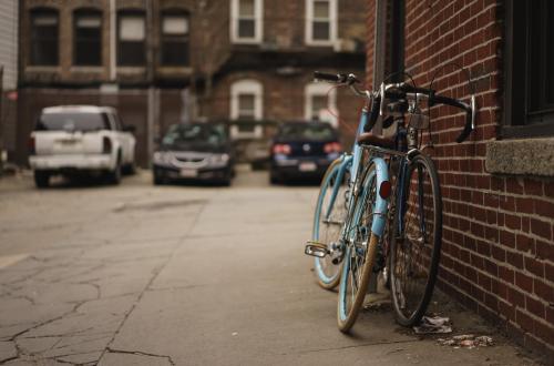 bicycles leaning on wall