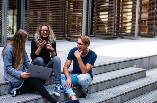 Students on staircase chatting