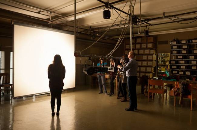 People testing theater lighting