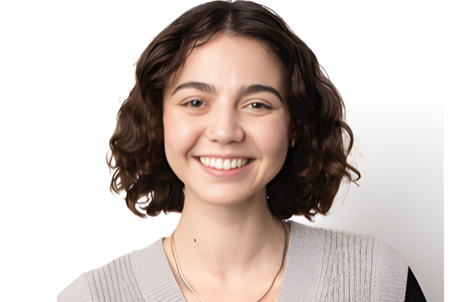 Picture of Celia Wandio, CS alumni. She is smiling and wearing professional attire. 