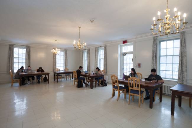 residents studying on tables in the whitney hall study room