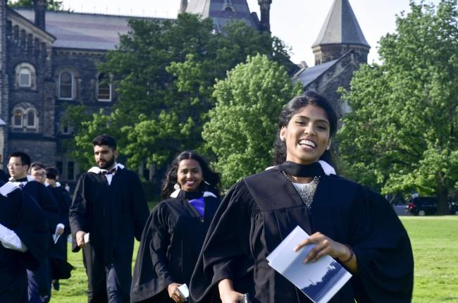 Students attending spring convocation in front of University College