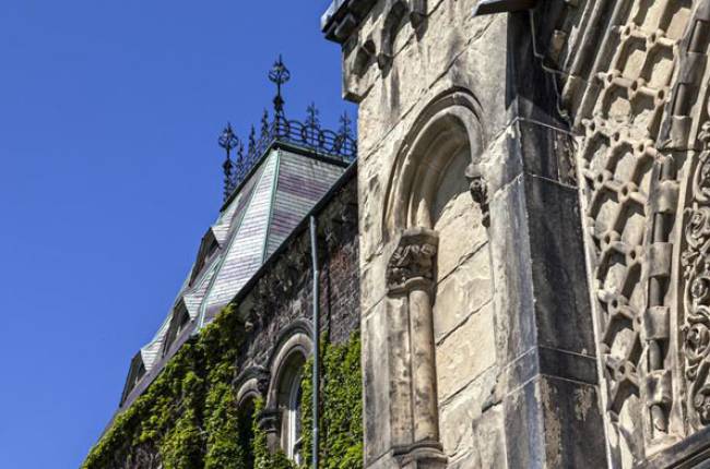 Side view of University College building in summer