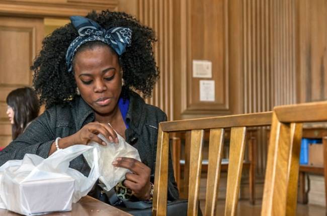 Woman eats at Howard Ferguson Dining Hall