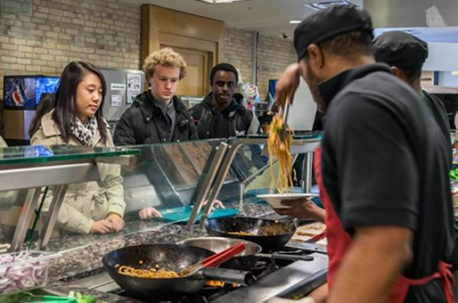 Students ordering food at the stir-fry station