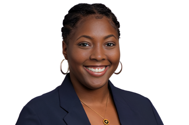 Picture of Shade Edwards, CS alumni. She is smiling and wearing professional attire.