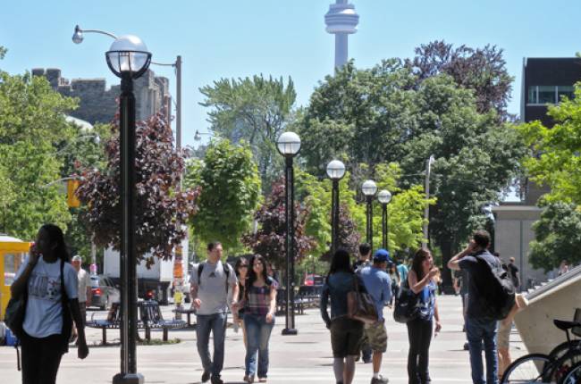 Students walking in front of Sidney Smith Hall
