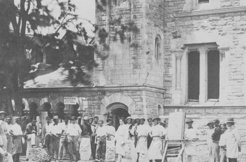 Group of more than 25 men standing in front of University College