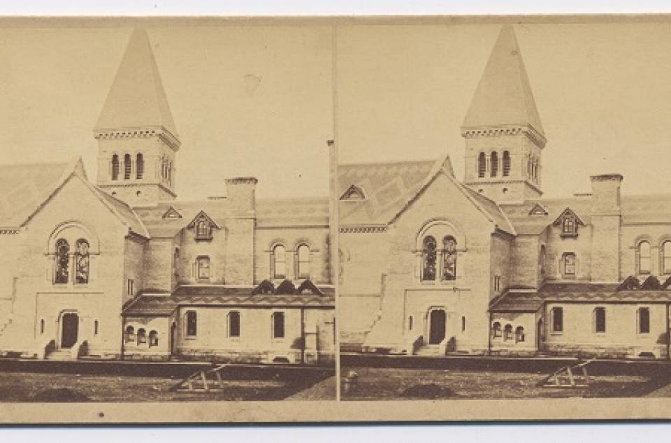 Two near-identical photos showing a tower, rooftops, and windows