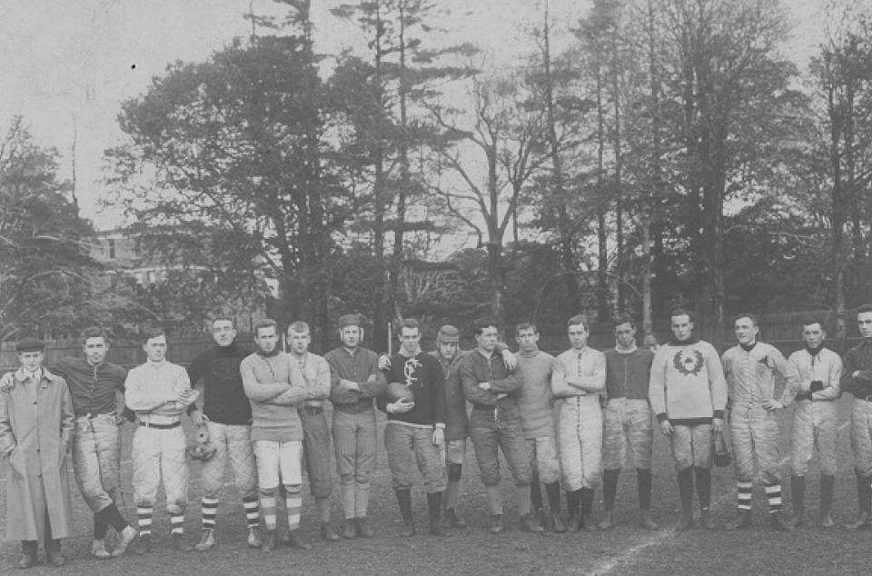 About 20 young men on a playing field