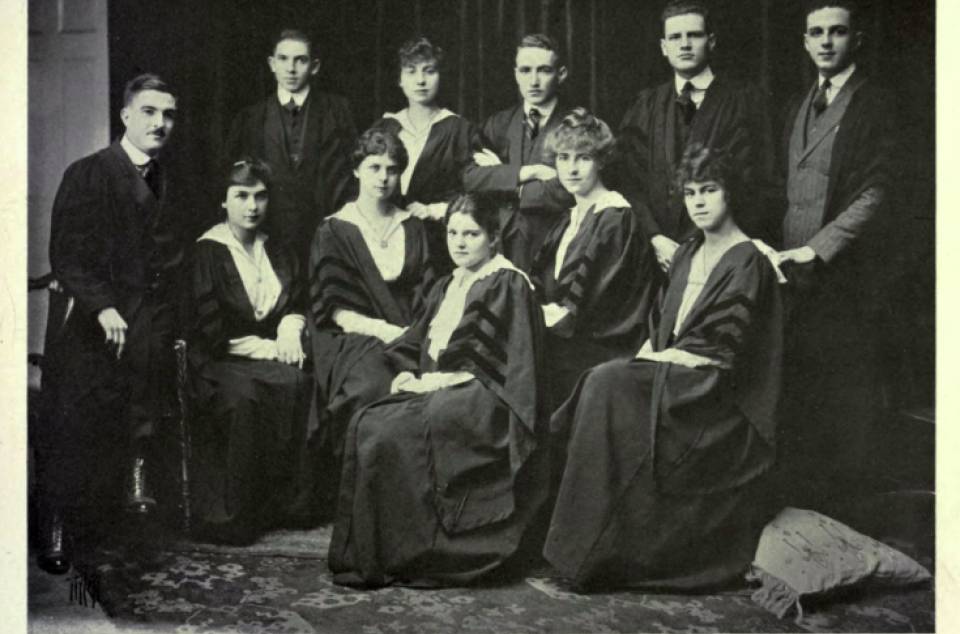 Six women and five men wearing academic robes