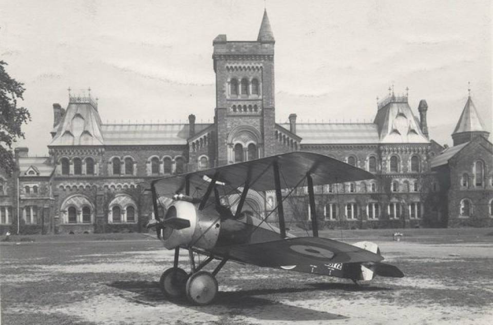 Airplane landed on grass in front of University College