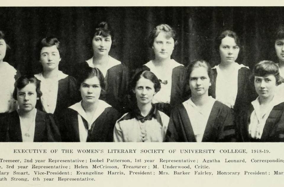 Eleven women in academic robes, with a caption listing their names and positions under the heading "Executive of the Women's Literary Society of University College, 1918-19"