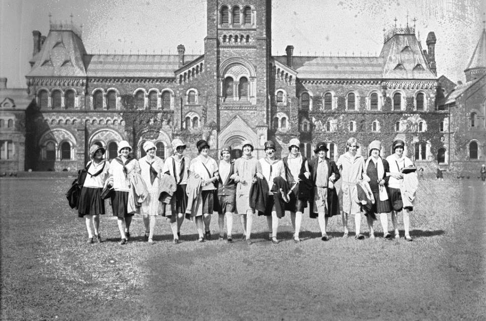 About 15 young women on front campus, with University College behind them