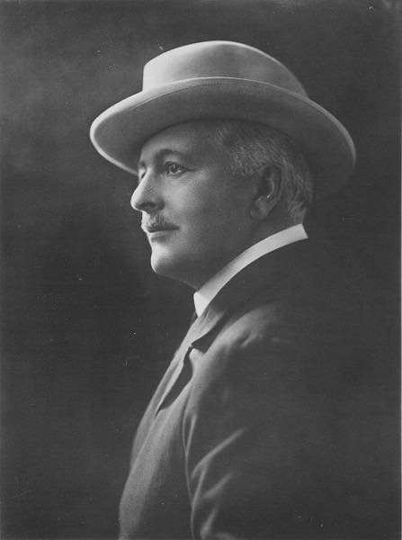 John Cunningham McLennan in suit and hat