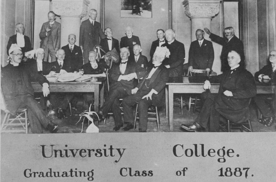 About twenty older men in suits, with names handwritten under the heading "University College Graduating Class of 1887"