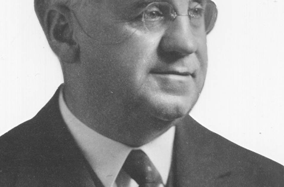 Gilbert Norwood wearing a three-piece suit