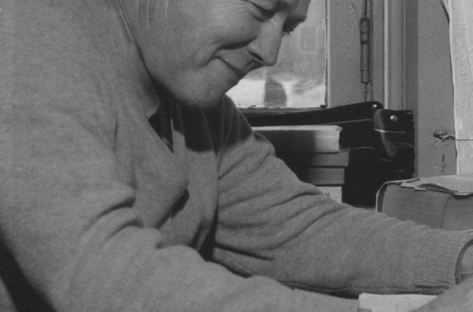 Professor Walter Bauer seated at desk