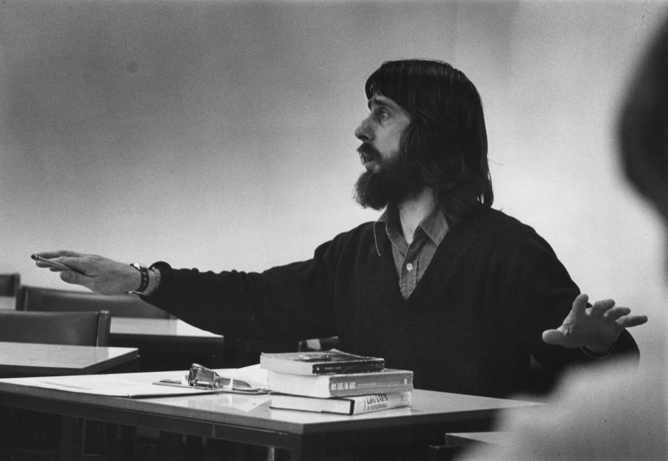 Stephen Martineau, teaching while sitting at a desk