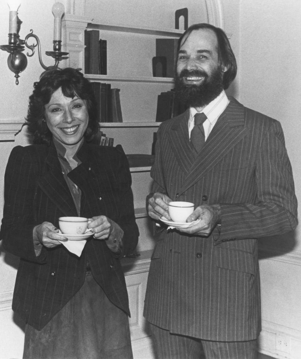 Barbara Frum and Peter Richardson holding tea cups