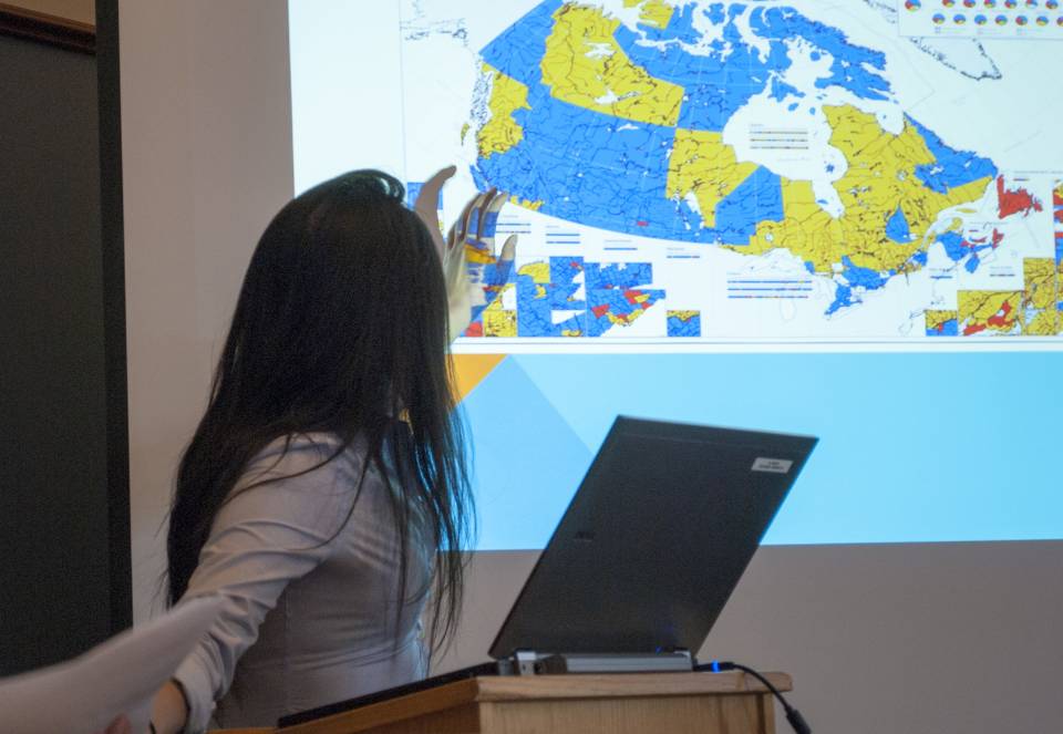 Woman presenting a lecture on Canada
