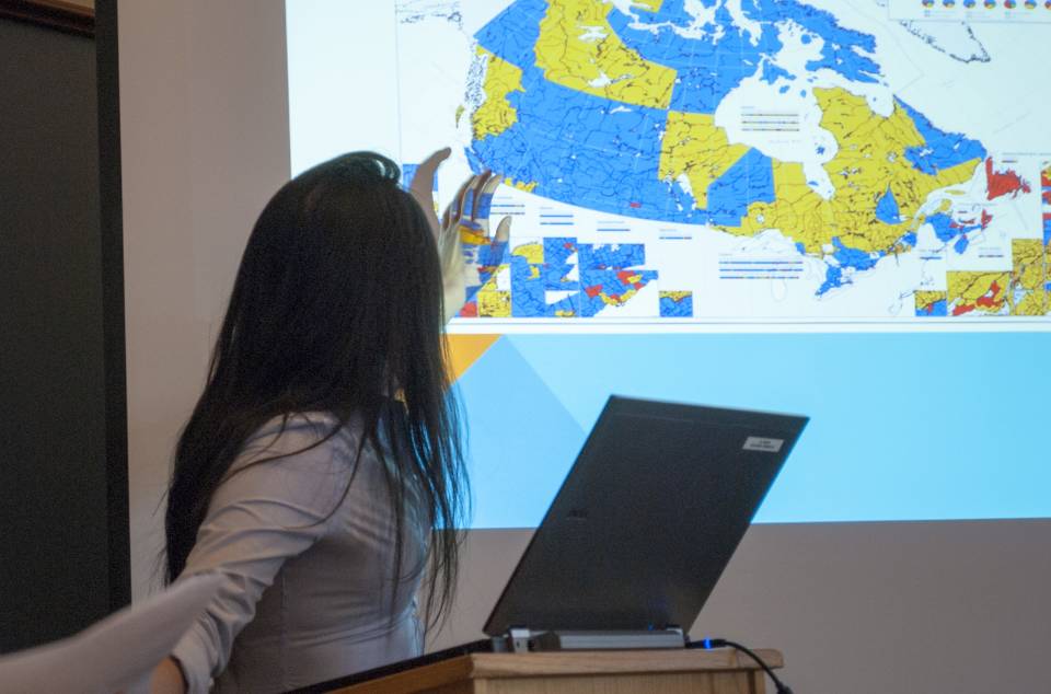 Woman presenting a lecture on Canada