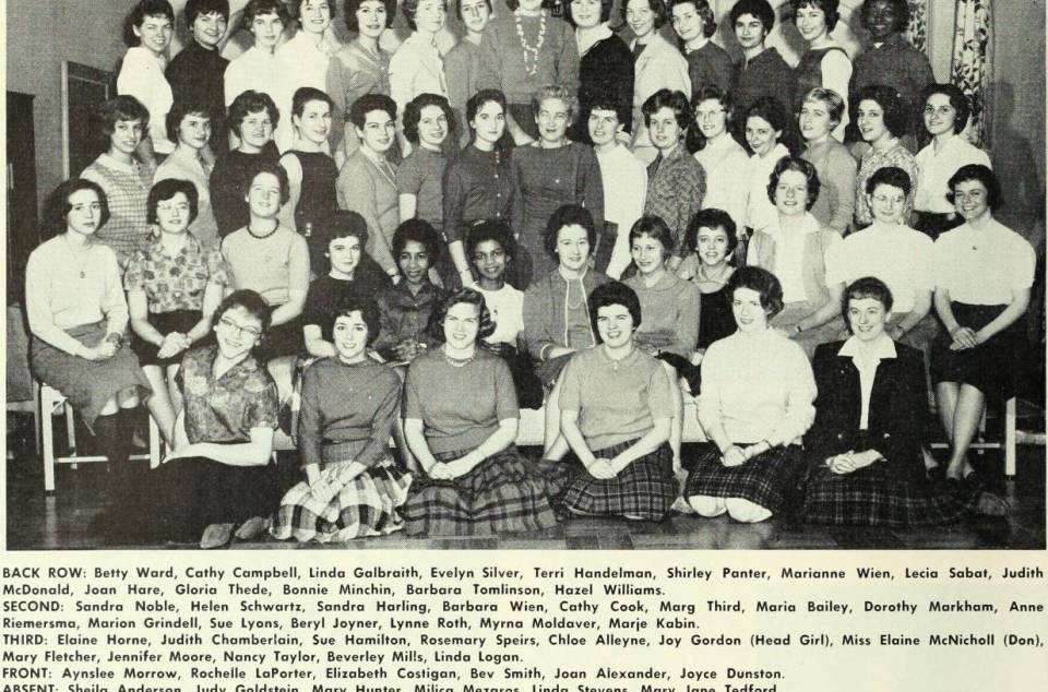 about 50 women in 4 rows, with their names listed below