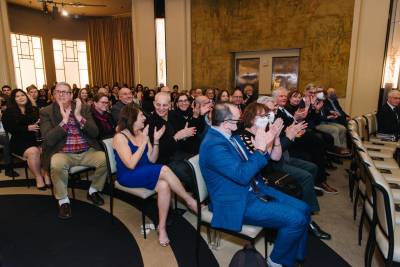 Attendees clapping together at UC Alumni Awards 2022