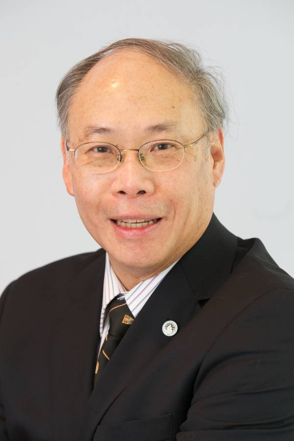 Portrait of B. Ralph Chou in a dark suit. He is smiling and wearing a small pin in his lapel.