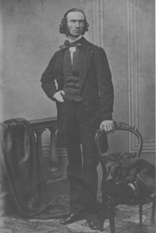 Daniel Wilson standing beside a chair