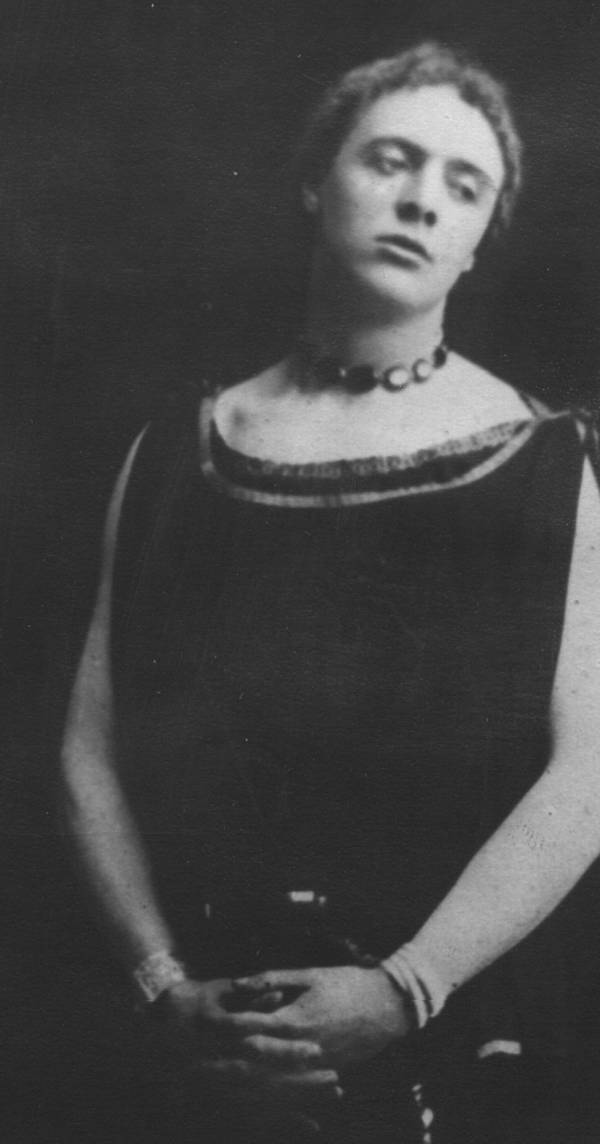 Maurice Hutton in a woman's dress and jewellery