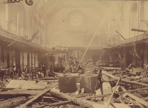 Museum destroyed by fire, with fire fighters